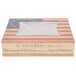 A 10" x 10" bakery box with a window and vintage American flag design on a table.