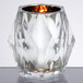 A Sterno Classic Elegance glass candle holder with a lit candle inside.