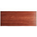 A rectangular wooden table top with a mahogany finish.
