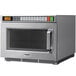 A silver Panasonic medium duty commercial microwave oven with a digital display.