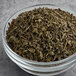 A bowl of Numi Organic Jasmine Green Loose Leaf Tea.