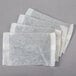 A group of white Numi organic classic black iced tea filter bags.