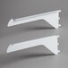 A pair of white metal Avantco air curtain shelf brackets.