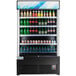 An Avantco black refrigerated air curtain merchandiser with bottles of soda and other beverages.