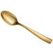A close up of a Bon Chef matte gold stainless steel soup/dessert spoon with a long handle.