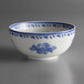 A close-up of a white and blue Oneida Lancaster Garden bowl with a blue and white floral design.