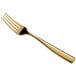 A close-up of a Bon Chef Manhattan gold stainless steel dinner fork with a white background.