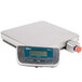 An Edlund stainless steel digital pizza scale with a screen on the front.