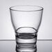 An Arcoroc Urbane stackable double old fashioned glass on a reflective surface.