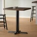 A Lancaster Table & Seating black cast iron counter height table base.