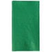 A green napkin with a white border.