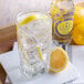 A glass of Boylan Lemon Seltzer with ice and a lemon slice.