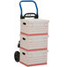 A Harper hand truck with three stacked boxes on it.