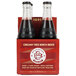 A Boylan Bottling Co. Creamy Red Birch Beer bottle with a label filled with dark red liquid.