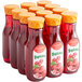 A group of Tropicana plastic bottles filled with red cranberry cocktail juice.