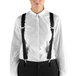 A woman wearing Henry Segal black suspenders over a white shirt.