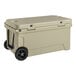 A CaterGator tan 65 quart cooler with wheels.