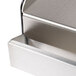 A stainless steel griddle top with a handle.
