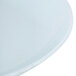 A white round melamine serving platter with a circular rim.