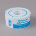 A white roll of adhesive tape with blue text.