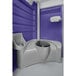 A PolyJohn portable restroom with a purple and white exterior and a sink inside.