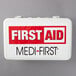 A white Medique first aid kit with red and black text.