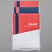 A Deflecto tiered document holder with brochures in it, including one with a red and blue rectangular cover.