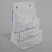 A clear plastic Deflecto magazine holder with three compartments.