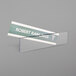 A clear Deflecto cubicle nameplate sign holder with a sign inside.