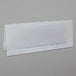 A clear plastic tent card holder on a white surface.