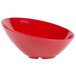 A red slanted melamine bowl with a white background.
