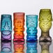 A group of colorful Tropical Tiki glasses on a table.
