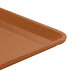 A close up of a Cambro suede brown dietary tray with a lid.