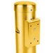 A gold metal wall-mounted cylinder with a metal lid.