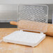 A white plastic container with clear compartments for Ateco pastry tips.