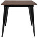 A Flash Furniture table with a black metal base and rustic wood top.