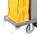 A yellow bag on a Lavex housekeeping cart wheel.