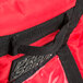 A close-up of a red Rubbermaid insulated delivery bag with a black logo.