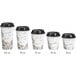 A row of four Choice white paper hot cups with brown bean designs and black lids.
