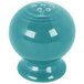A turquoise Fiesta salt shaker with holes.