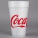 A white Dart foam cup with a red Coca-Cola logo.