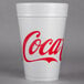 A white Dart foam cup with red Coca-Cola text.