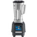 A Waring TBB175S6 blender with a black and silver touchpad.