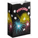 A black Bagcraft Packaging popcorn bag with fireworks on it.