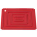 A red rectangular Lodge silicone pot holder.