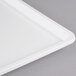 A close-up of a white rectangular Winholt display tray.