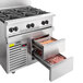 A large stainless steel Vulcan range with an open refrigerated drawer.