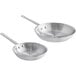 A pair of silver aluminum frying pans.