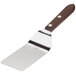 A Victorinox solid grill turner with a wood handle.