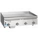 A large stainless steel Vulcan liquid propane griddle on a counter with knobs.